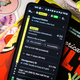 A photo of an Android phone laying across a book, with the Maps app open
